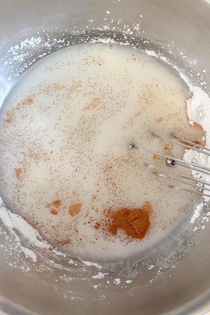 Whisking together cornstarch sugar slurry.