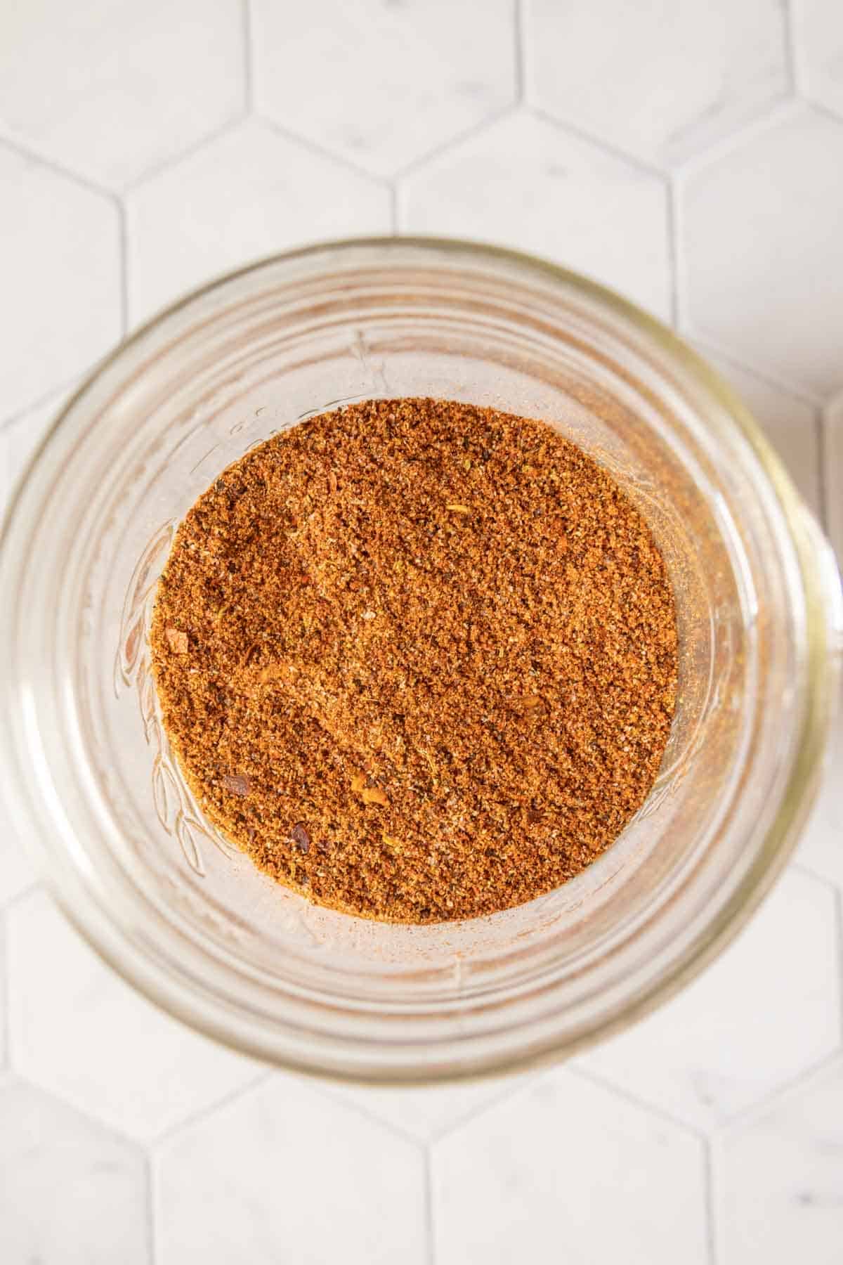 Homemade taco seasoning mix in a jar from overhead.