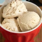A red bowl filled with three scoops of creamy no-churn ice cream. Text at the top reads "No Churn Ice Cream." Website "stetted.com" appears at the bottom.