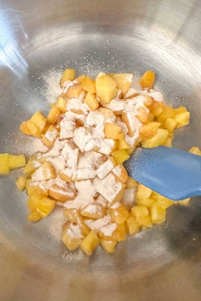 Peaches, lemon juice, and pectin in a saucepan.
