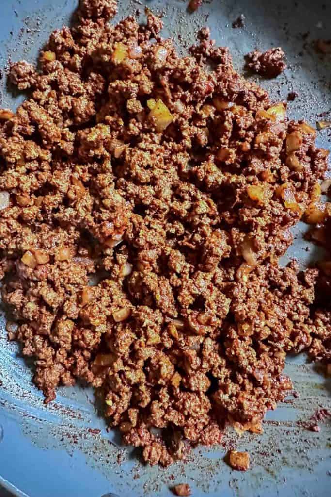 Cooked bison taco meat in a pan.