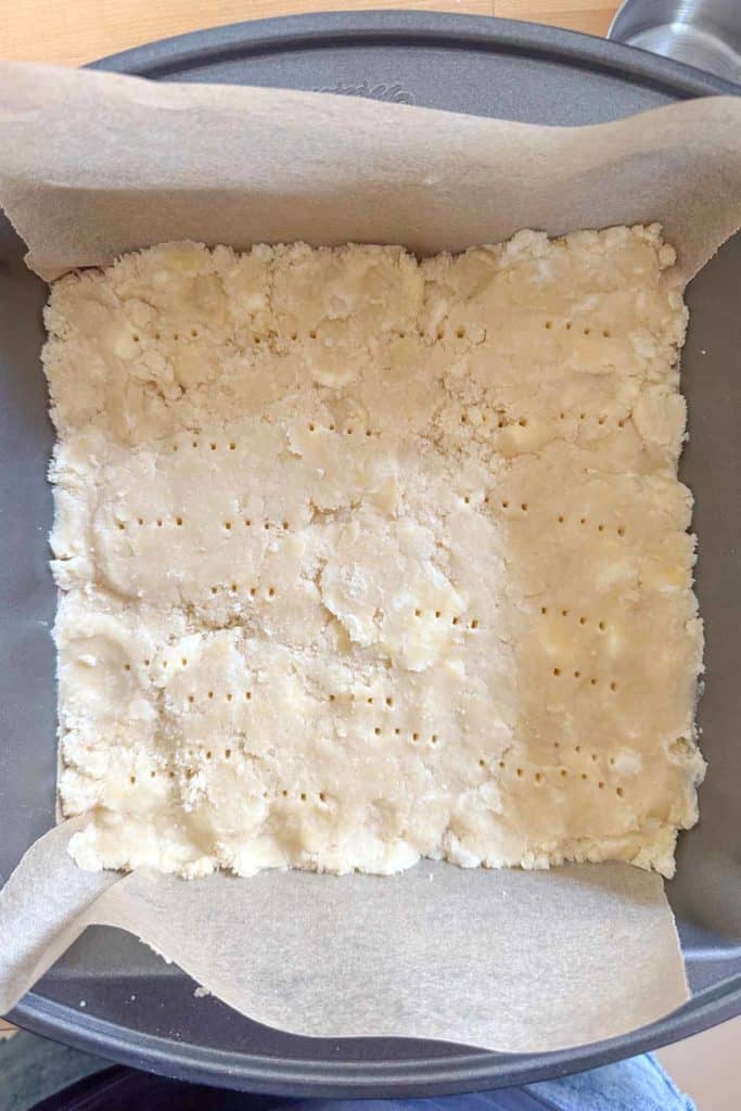 Pie bar crust in a square pan.