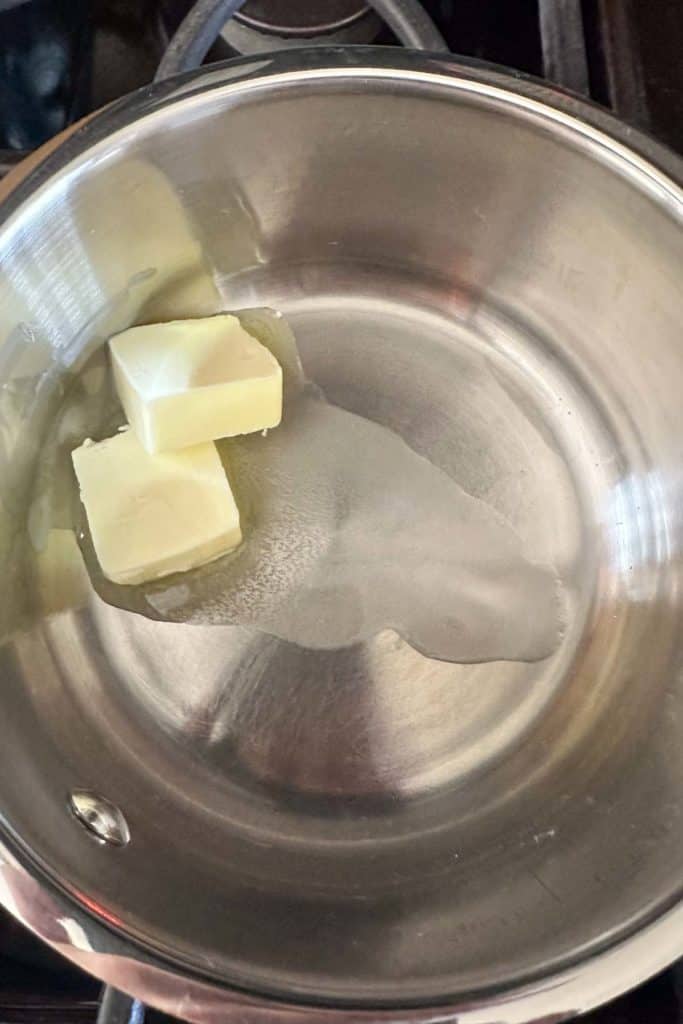 Melting butter in a saucepan.