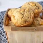 Peach muffins in a fruit basket.