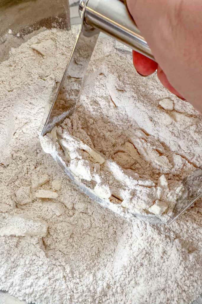 Cutting butter into dry ingredients for scones.