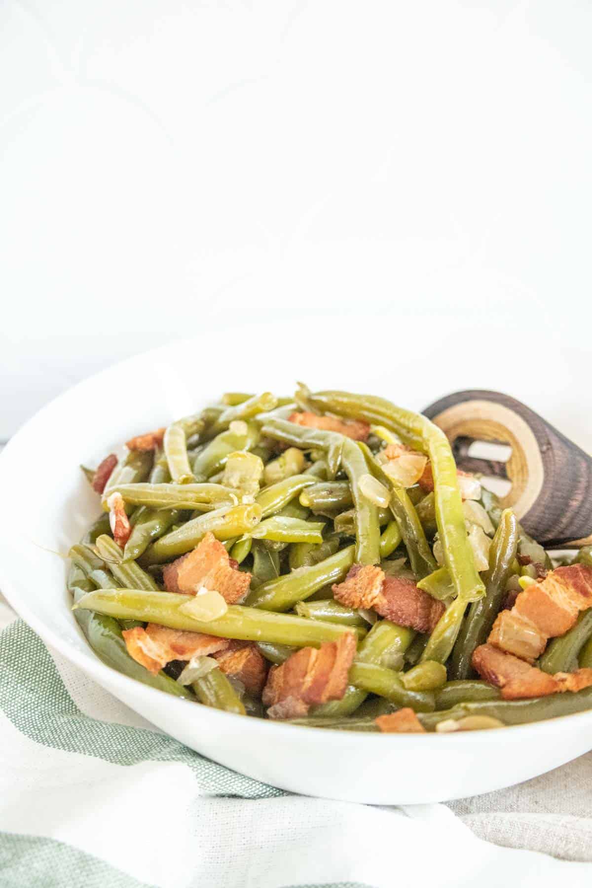 White bowl of southern green beans.