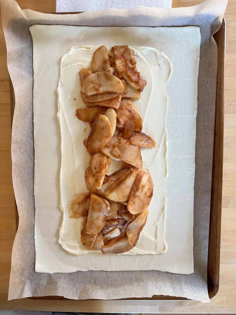 Apple danish on a baking sheet.