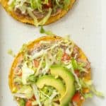 Two tostadas on a white plate.