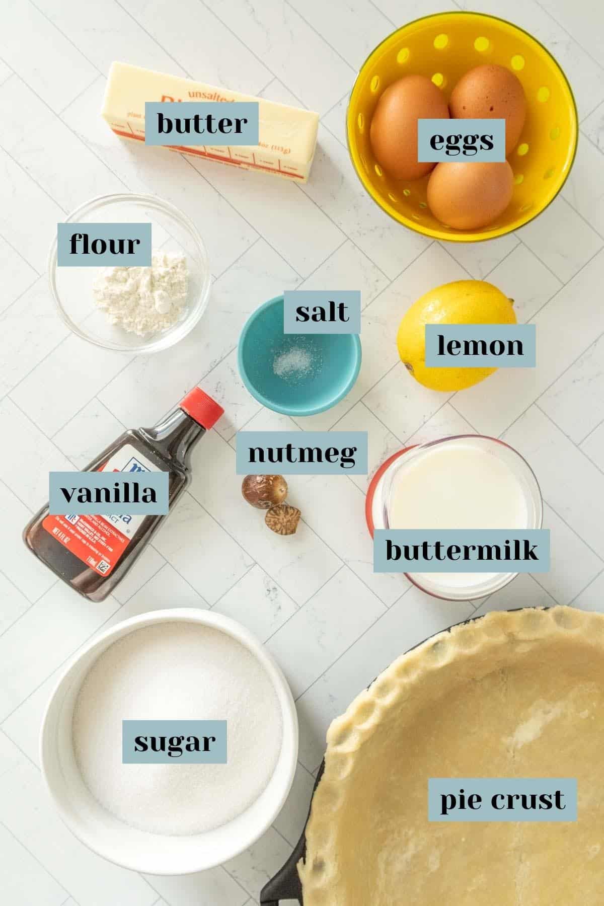 The ingredients for a pie are laid out on a table.