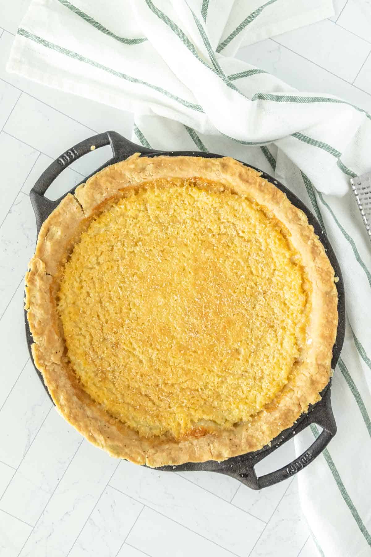 Buttermilk pie in a cast iron skillet.