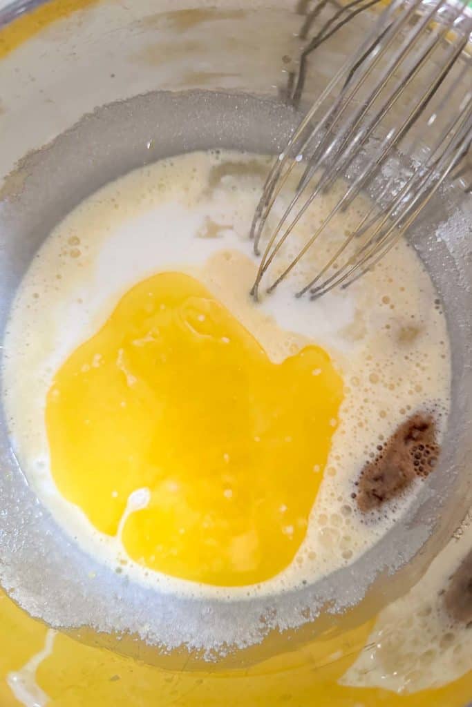 Buttermilk and melted butter being added to custard.