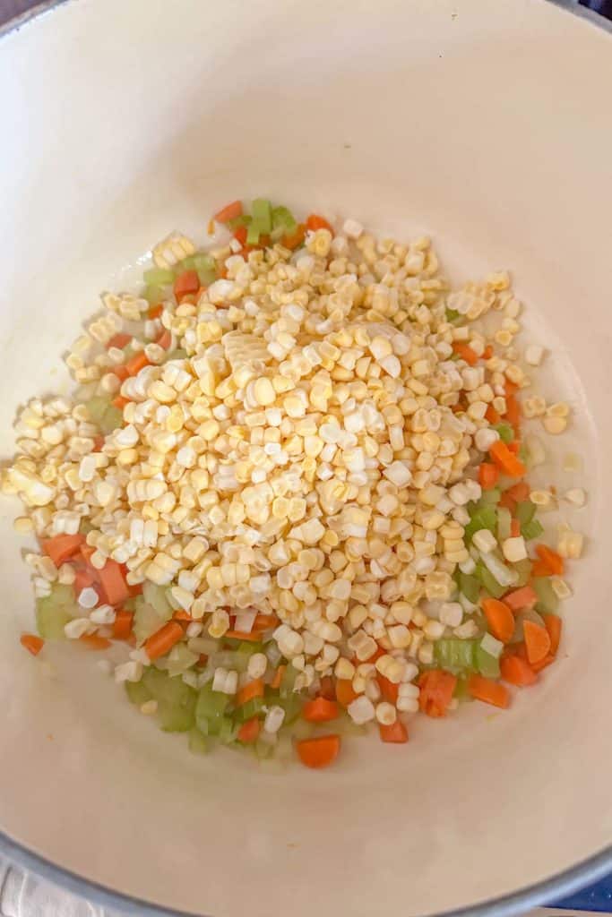 Corn and vegetables in a pot to sauté.