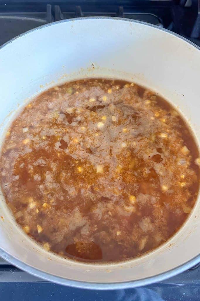 Corn soup simmering in a pot.