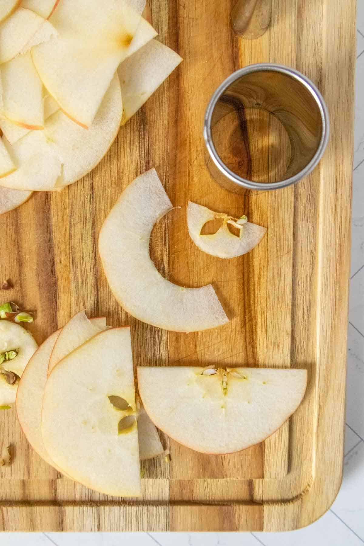 Sliced apples on a cutting board.