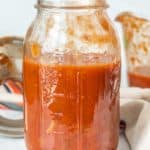 Homemade tomato sauce in a mason jar.