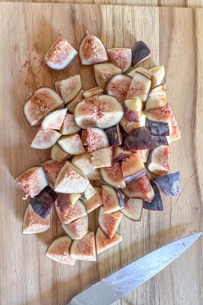 Sliced figs on a cutting board.