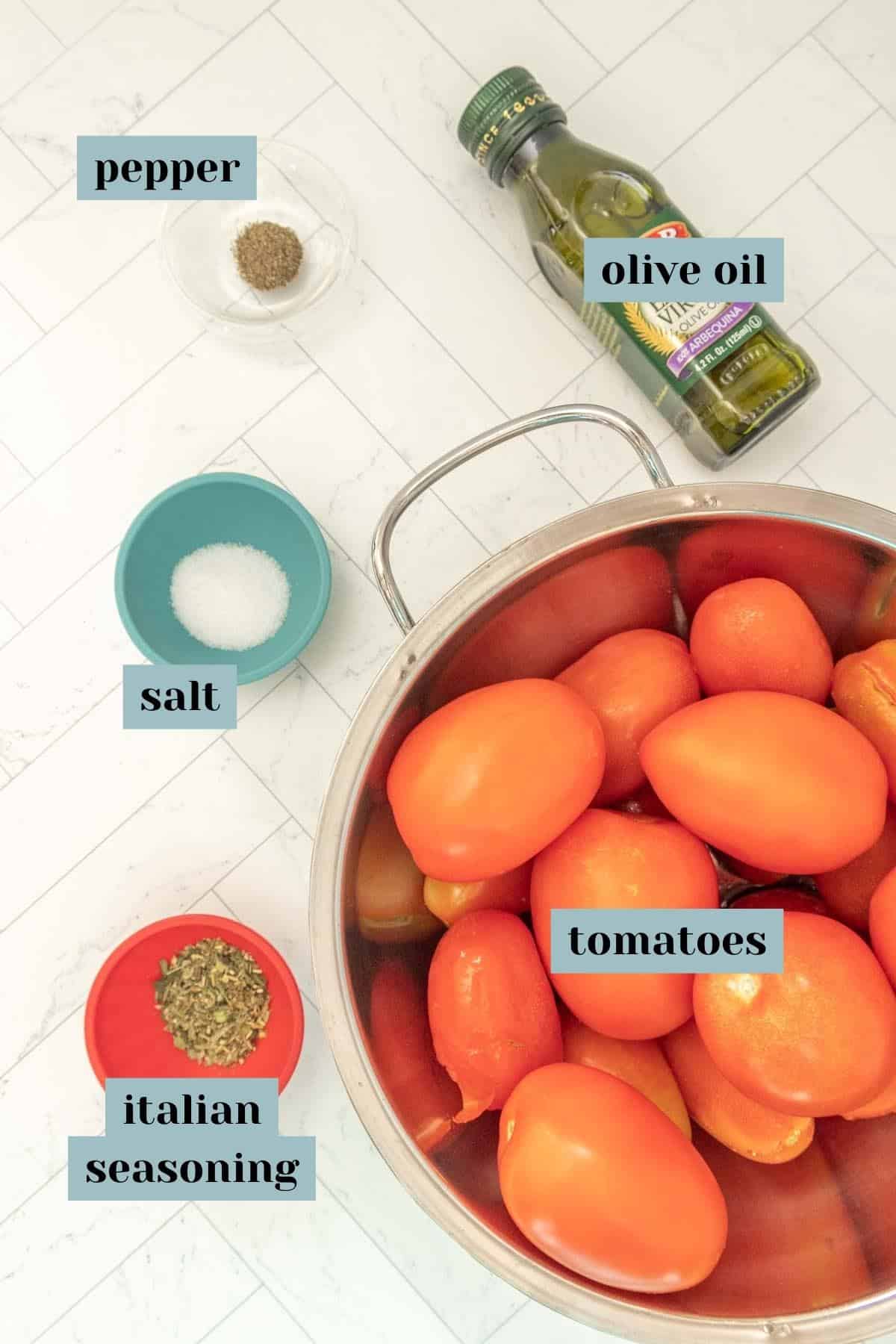 A bowl with tomatoes, olive oil, salt and pepper.