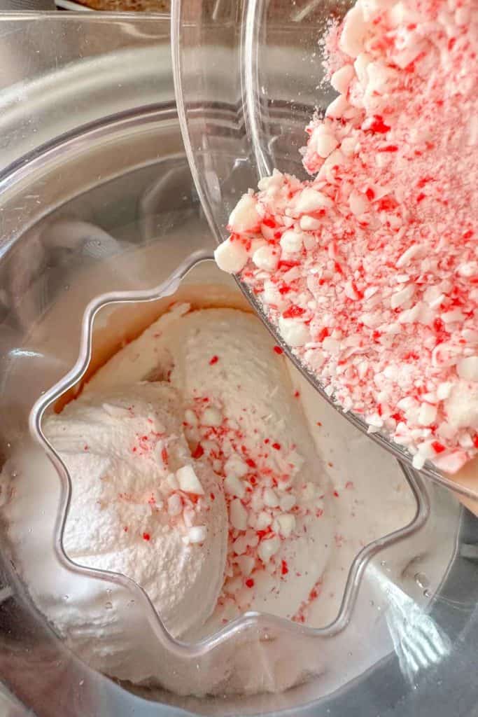 An ice cream maker filled with peppermint ice cream.