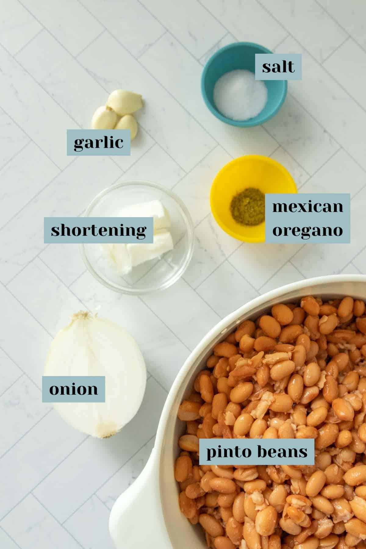 Ingredients for refried beans on a counter.