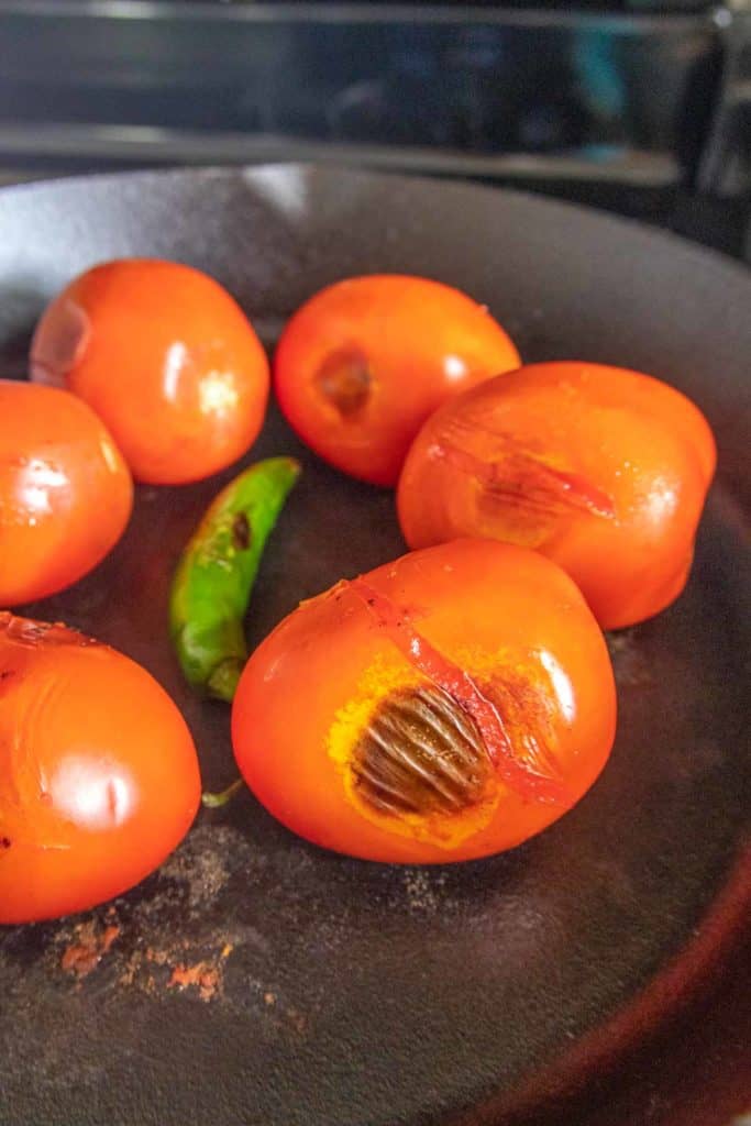 Roasted tomatoes in a skillet.