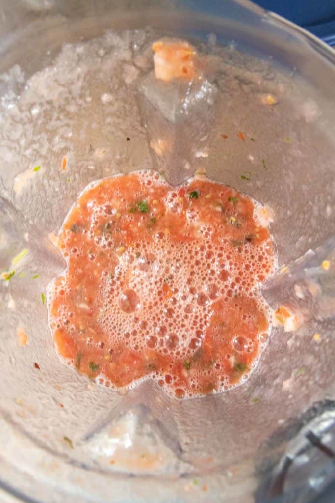Blended salsa in a blender pitcher.