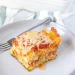Slice of zucchini lasagna on a gray plate.