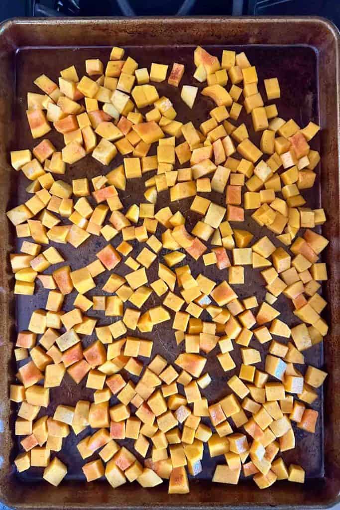 A baking sheet full of cubed butternut squash.