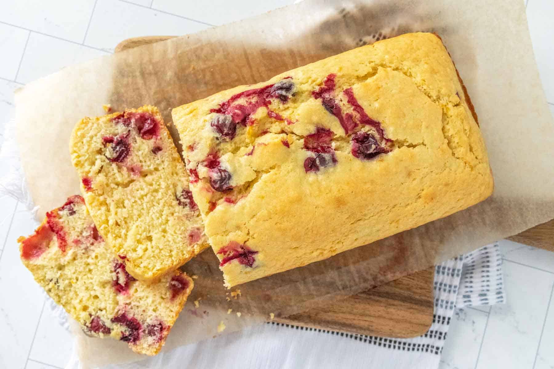 Cranberry bread on a cutting board.