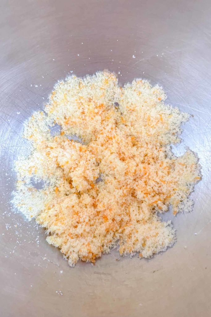 A bowl filled with orange zest sugar.
