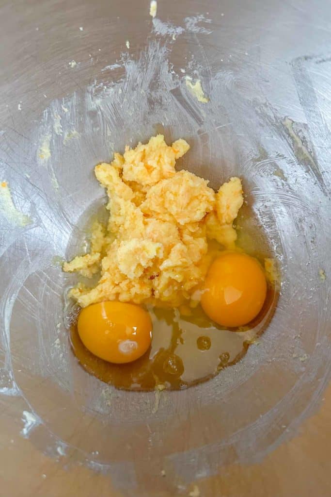 Two eggs in a mixing bowl.