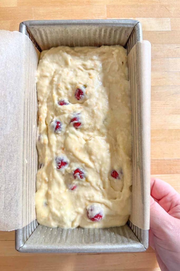 A pan of cranberry bread with cranberries in it.
