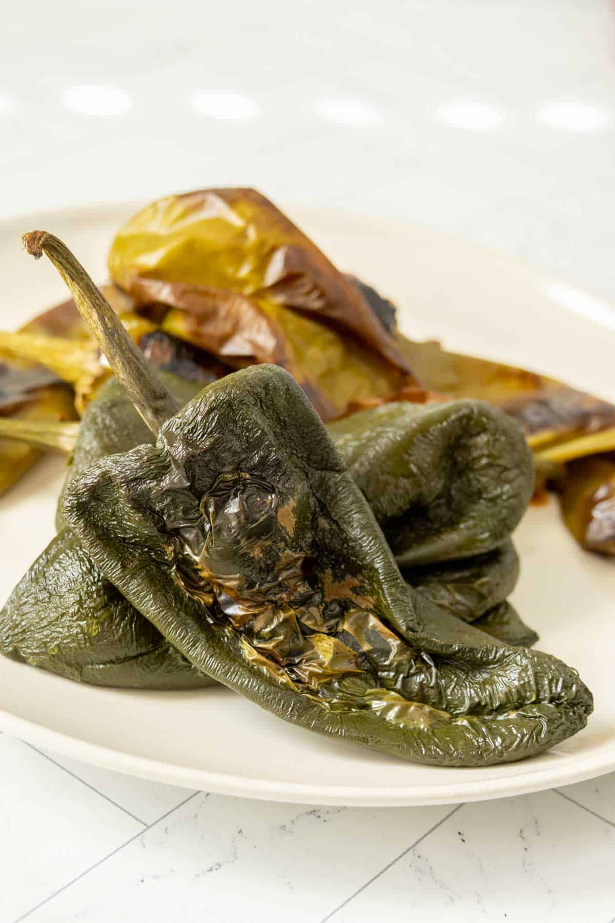 Roasted peppers on a white plate.