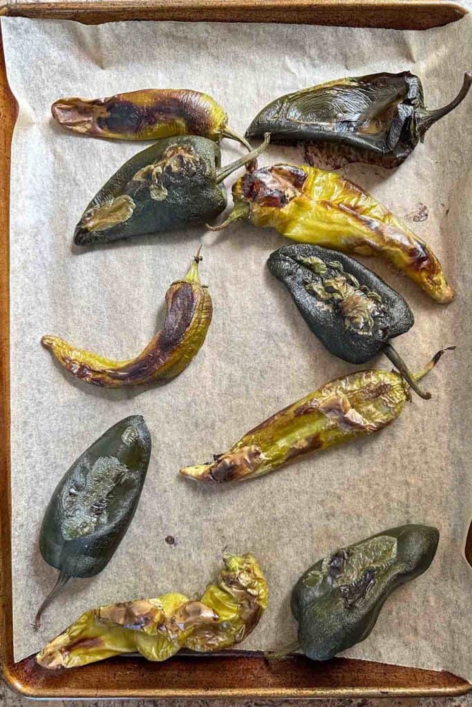 Roasted peppers on a baking sheet.