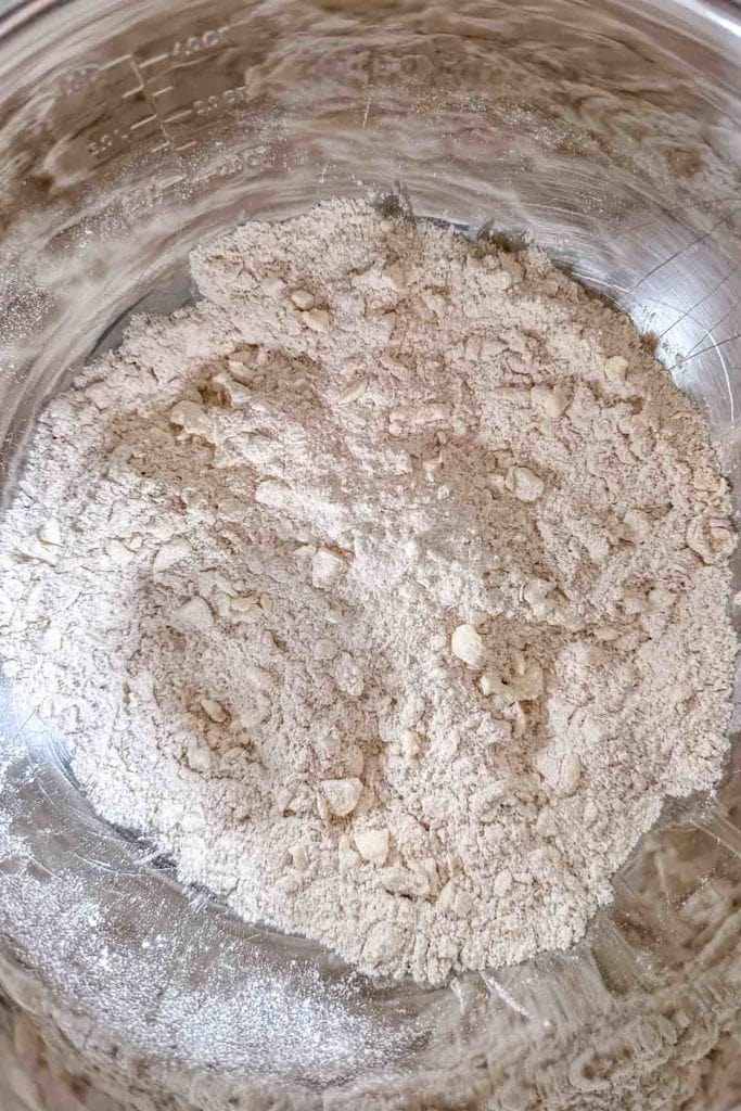 A bowl full of flour in a silver bowl.