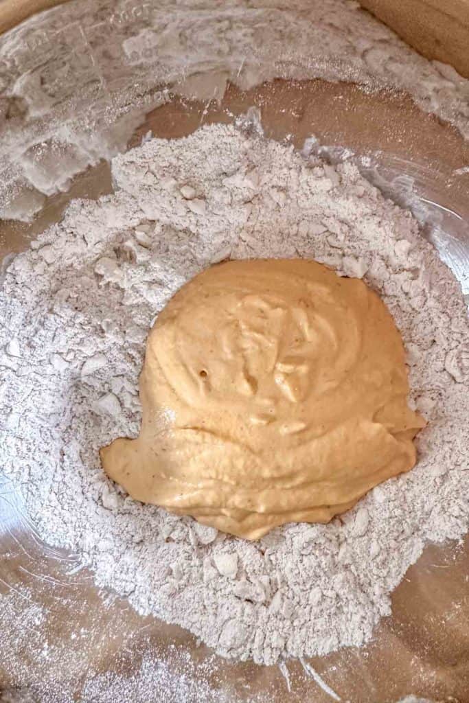Flour and pumpkin mixture in a bowl.