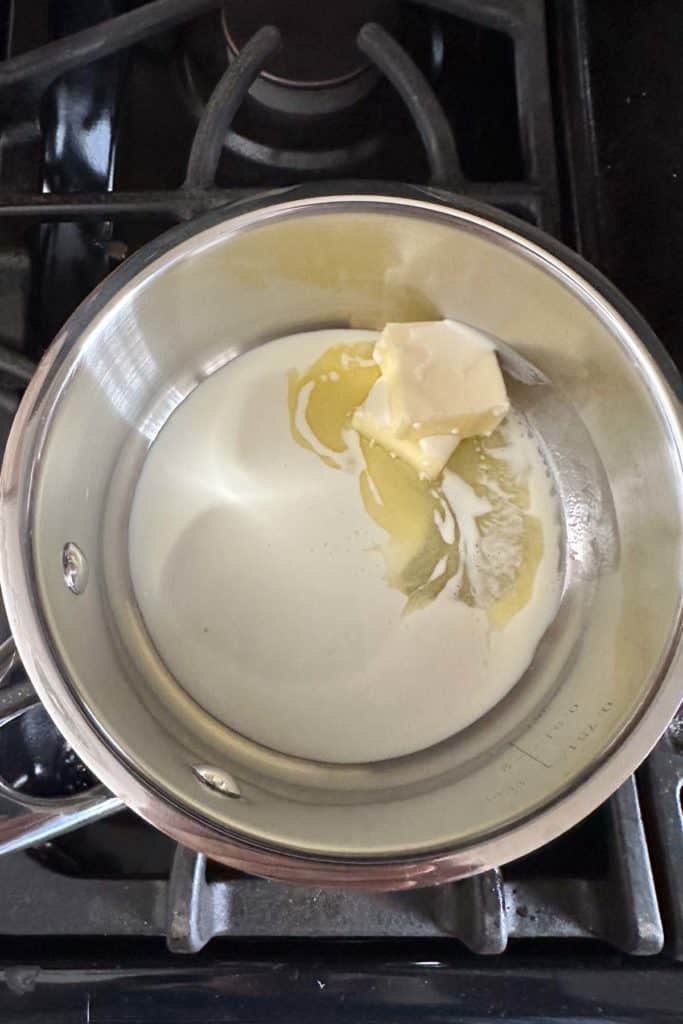 Butter in a pan on a stove top.