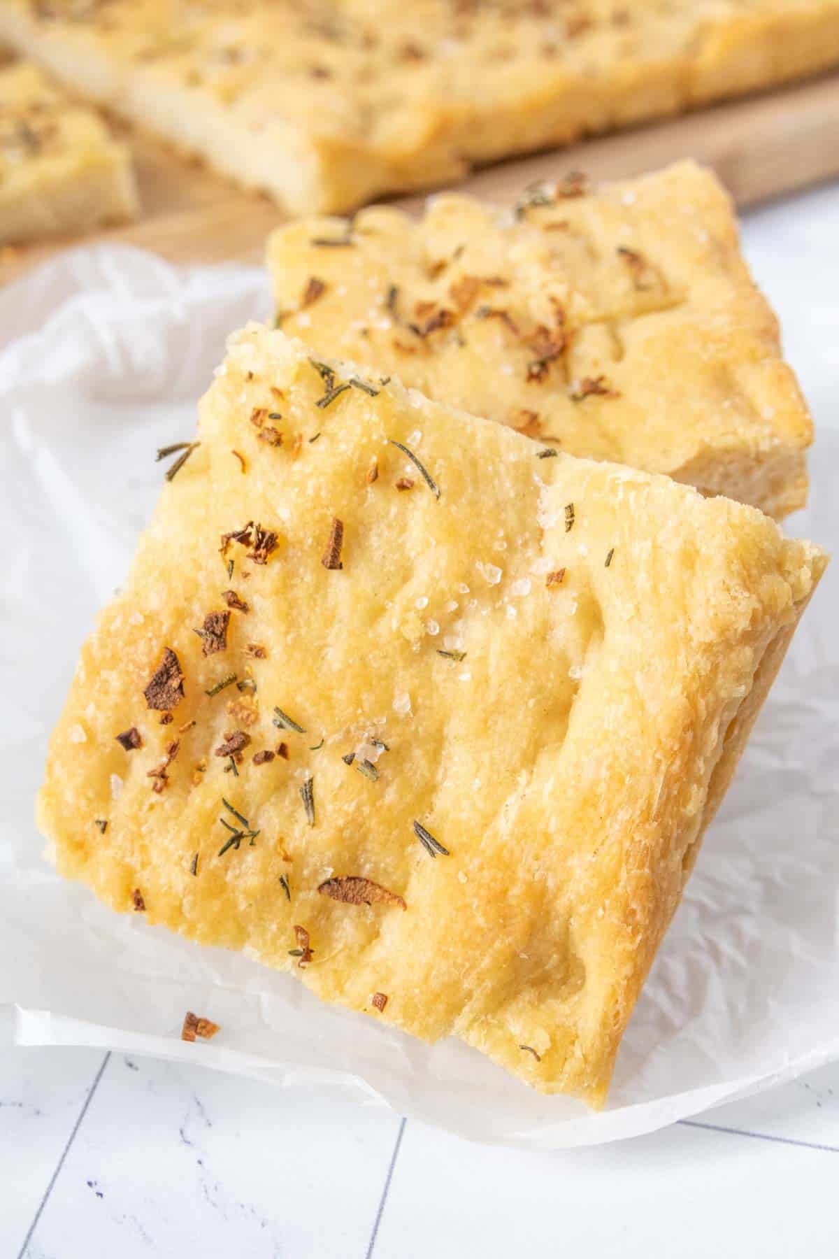 A piece of bread with herbs on it.