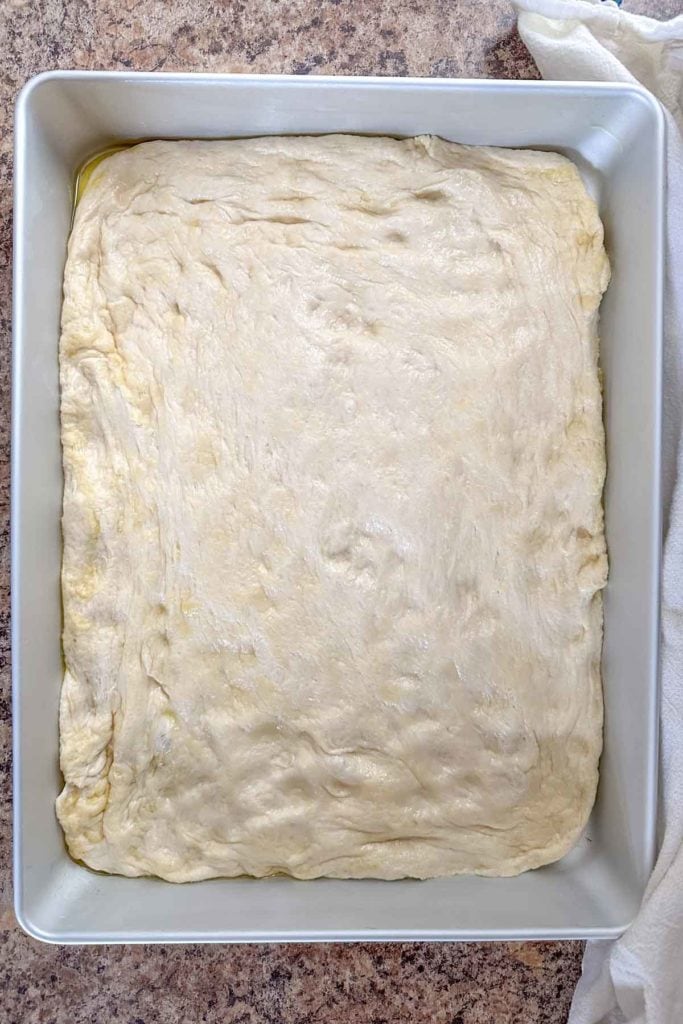 A square of dough in a baking pan.