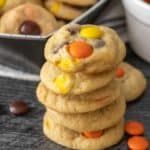 A stack of candy cookies on a plate.