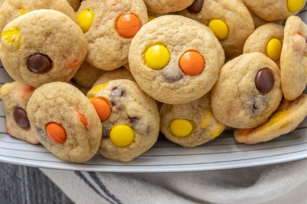 Reese's Pieces cookies in a bowl on a table.