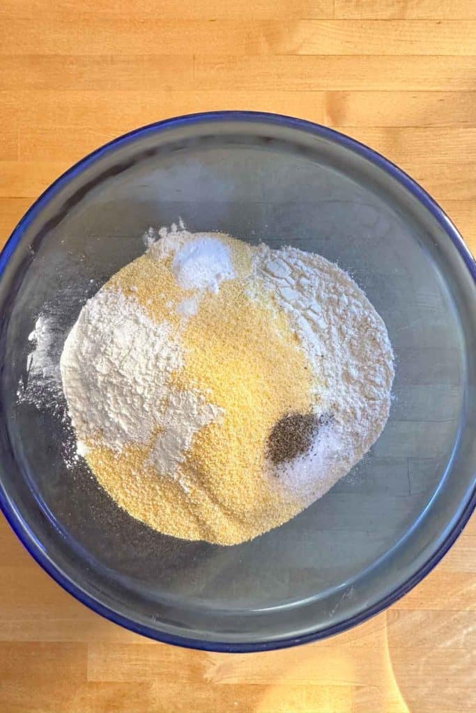 A bowl filled with flour and other ingredients.