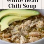 White bean chili soup in a bowl with avocado and plum jam.
