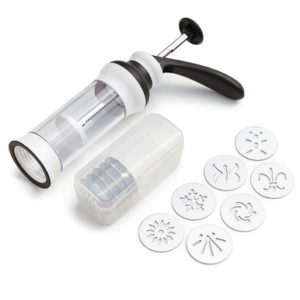 A food processor with a plastic container and a set of cookie cutters.