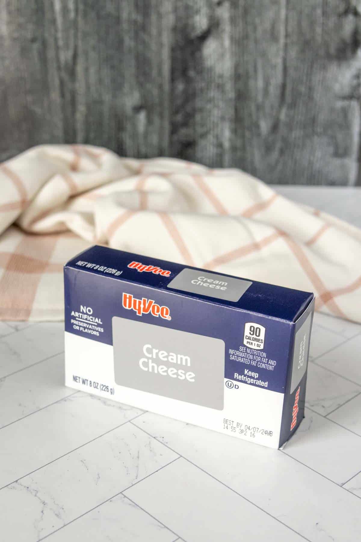 A box of cream cheese sitting on a table.