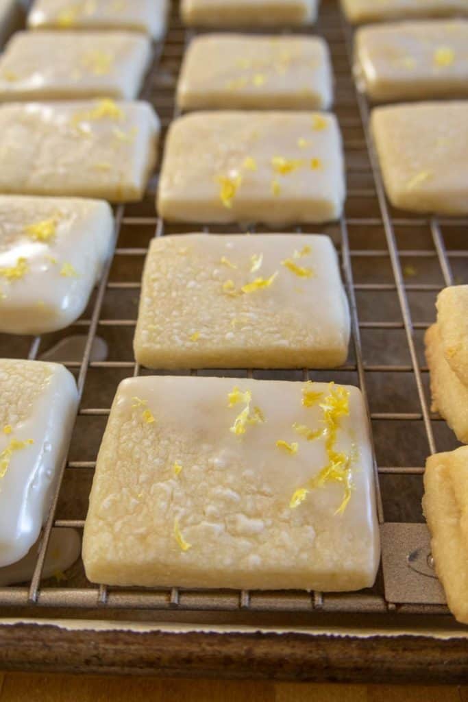 Lemon cookies on a cooling rack.