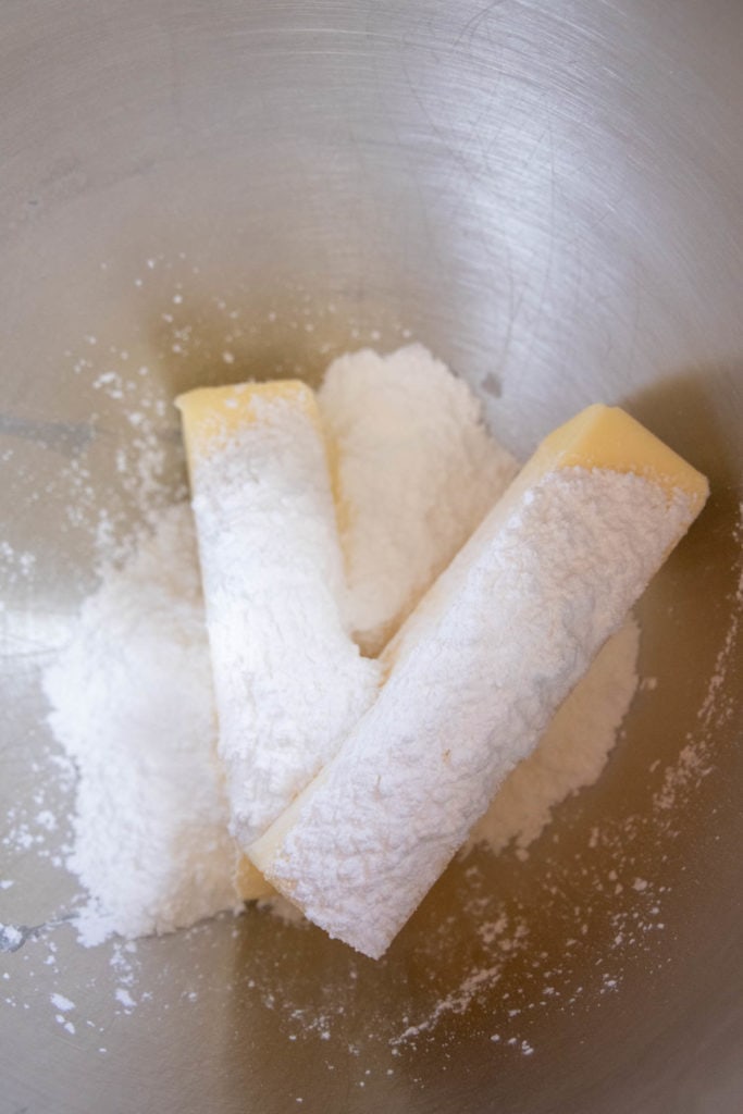 Butter and powdered sugar in a bowl.