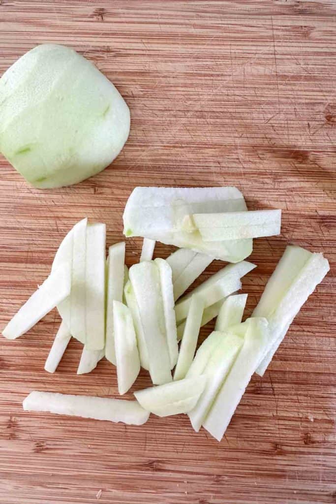 Sliced apples on a cutting board.