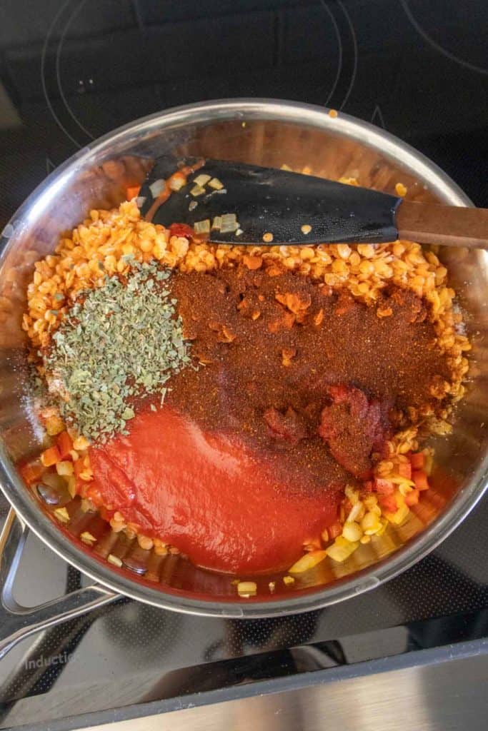 Ingredients in a pan on a stove top.