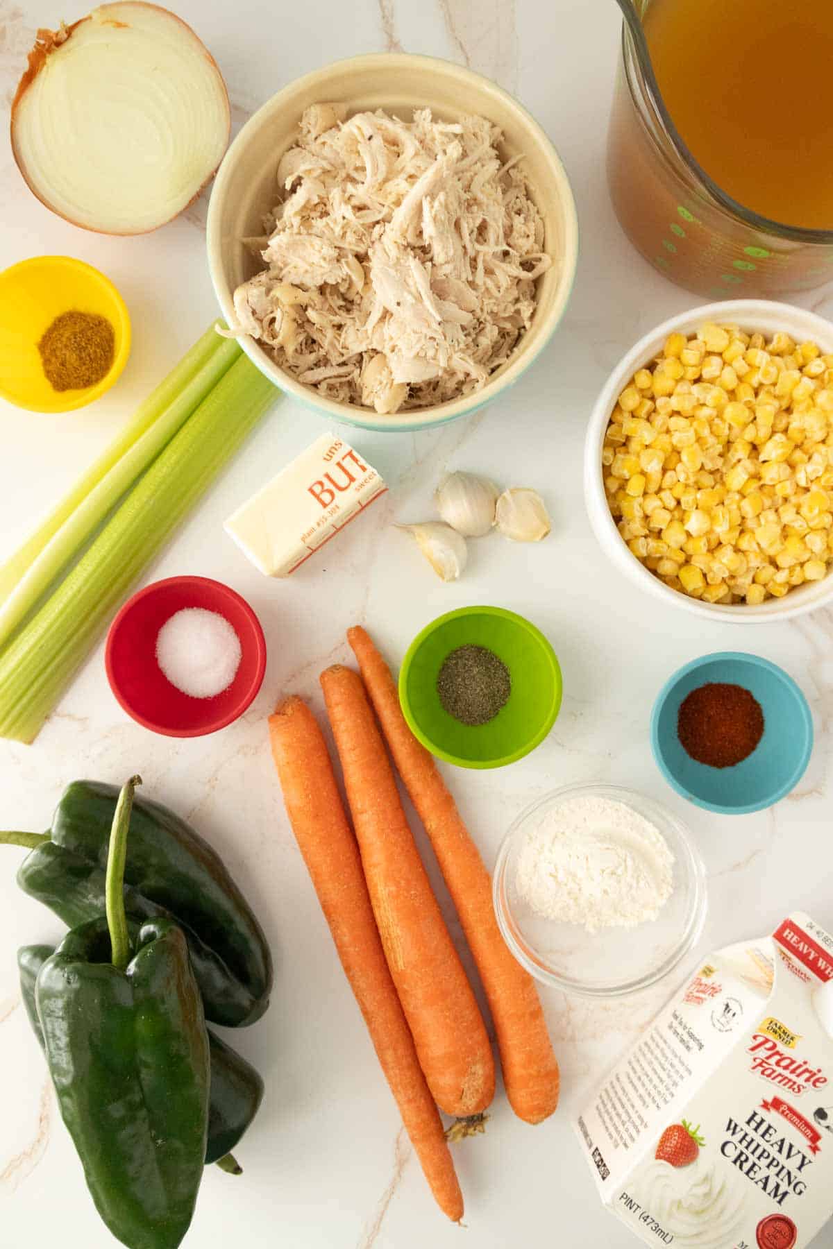 Chicken poblano soup ingredients laid out on a table.