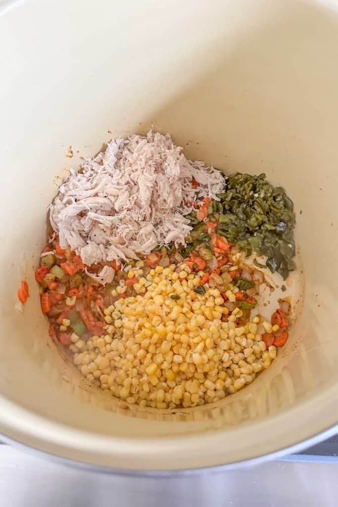 The ingredients for a chicken soup in a bowl.